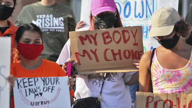 Abortion rights supporters gather to protest the Texas law in front of Edinburg City Hall in Edinburg, Texas. 