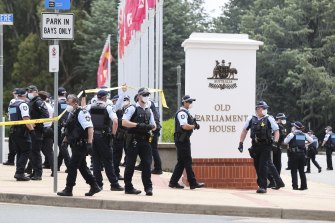 Police at Old Parliament House on Thursday. Conspiracy theorists have said they will try to take it over on Saturday.