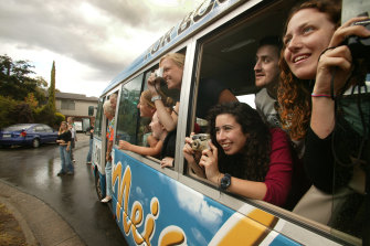 The exterior set of Neighbours in Vermont is visited by a busload of tourists in 2004.
