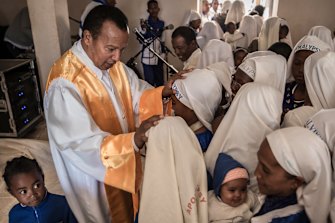 Andre Christian Dieudonne Mailhol, the founder of the Church of the Apocalypse, with followers in Ankazobe, Madagascar, in late May 2019.