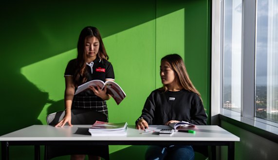 Tutor Tracy Kuo with student Emily Yu.
