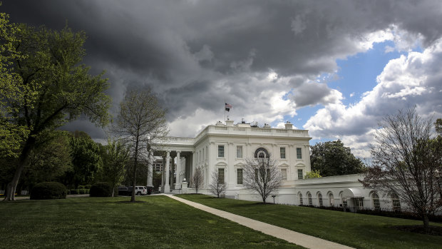 Storm clouds gather above the White House in Washington.