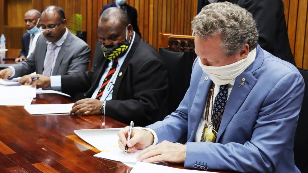 PNG Prime Minister James Marape and Andrew 'Twiggy' Forrest signing an agreement in Port Morseby in September on one of the first legs of his world tour.
