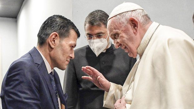 Pope Francis speaks to Abdullah Kurdi, left, father of Alan Kurdi, a 3-year old Syrian boy who’s image made headlines after he drowned in the Mediterranean Sea and drew global attention to Europe’s refugee crisis.