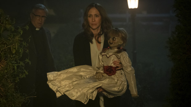 Vera Farmiga (centre) with the possessed doll in Annabelle Comes Home.