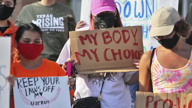 Abortion rights supporters gather to protest the Texas law in front of Edinburg City Hall in Edinburg, Texas. 