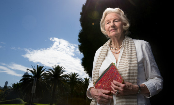 Elvala Ayton, at Melbourne's Shrine of Remembrance, with one of five notebooks of her father-in-law Philip Owen Ayton's WWI diary. 