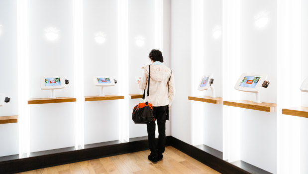 iPads line the walls where customers order their food at the automated restaurant Eatsa in San Francisco.