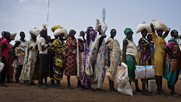 Women who fled fighting in nearby Leer in recent months, queue for food aid at a food distribution made by the World Food Program in Bentiu in 2016.