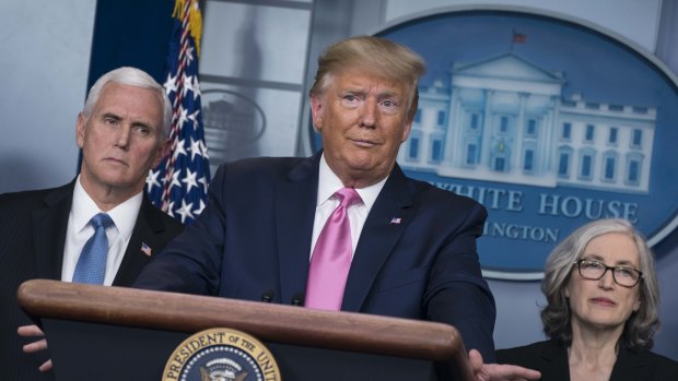 Donald Trump with Vice President Mike Pence and Anne Schuchat, director of the Centers for Disease Control (CDC). The Trump administration is now singing the praises of universal sick pay.