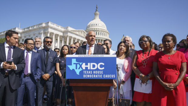 State Representative Chris Turner, chairman of the Texas House Democratic Caucus, and Democratic members of the Texas legislature hold a news conference at the Capitol in Washington.