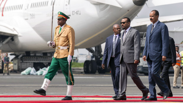Eritrean President Isaias Afwerki, right is welcomed by Ethiopia's Prime Minister Abiy Ahmed, second right upon his arrival at Addis Ababa International Airport, Ethiopia, on Saturday.