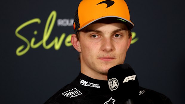 Oscar Piastri talks to the media at Silverstone.