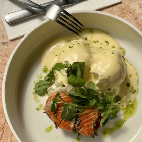 Dill-cured salmon with soft-boiled eggs, cream cheese and a bagel.