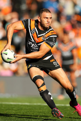 Robbie Farah's broken leg takes the weight as he prepares to pass against the Sharks.
