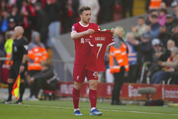 Liverpool’s Diogo Jota celebrates after scoring his side’s opening goal holding the jersey of teammate Luis Diaz during the English Premier League match between Liverpool and Nottingham Forest.