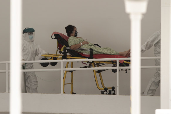 A coronavirus patient is transferred to a hospital in San Salvador, El Salvador.