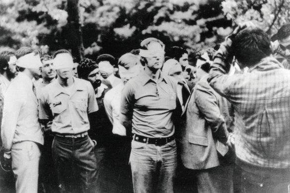The first day of occupation of the US embassy in Tehran in 1973 shows US hostages being paraded by their militant Iranian captors.