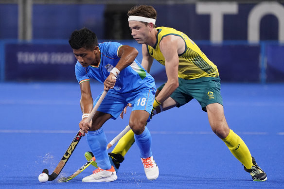 India’s Nilakanta Sharma and Australia’s Flynn Andrew Ogilvie battle for the ball.