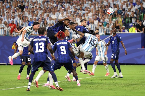 Cristian Romero heads the ball into the net.