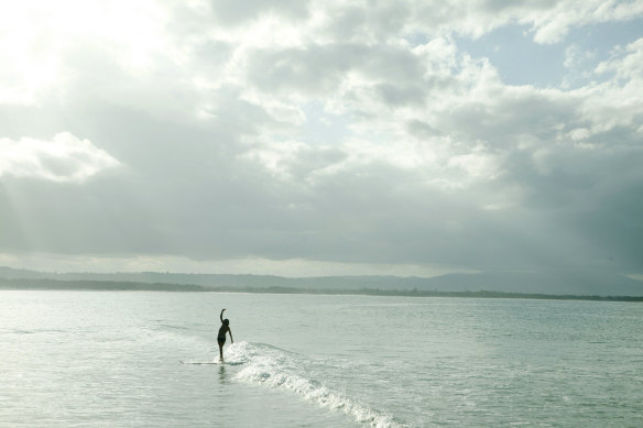 A surfer at The Pass in Byron Bay.