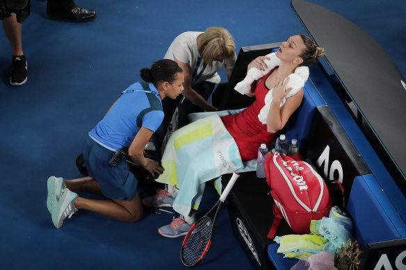 Simona Halep receives medical treatment during her final against Caroline Wozniacki.