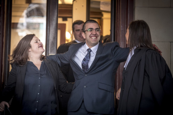 Faruk Orman, flanked by the lawyers who ran his criminal appeal, walks free from the Supreme Court in July 2019.