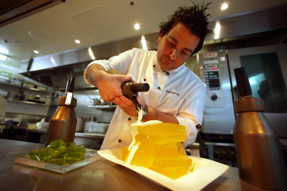 Spiky-haired and hungry in 2003, George Calombaris pours champagne foam over gin and tonic jelly at Reserve.  