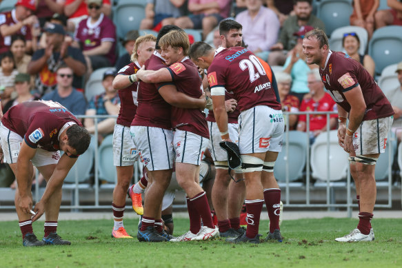 Queensland Reds celebrate their triumph over the Saitama Wild Knights.