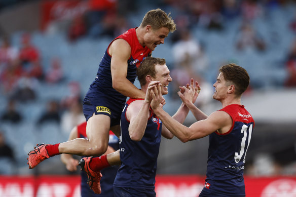 The Demons celebrate a Harrison Petty goal.