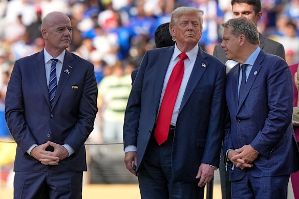 Donald Trump talks with Todd Boehly, right, a co-owner of the Los Angeles Dodgers who has donated $US2 million to the US president’s political causes.