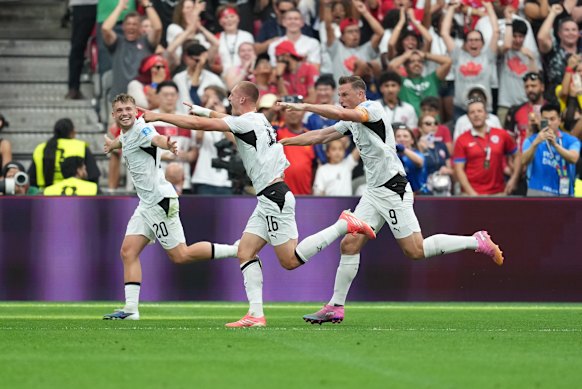 Surman celebrates after his 15th-minute goal. 