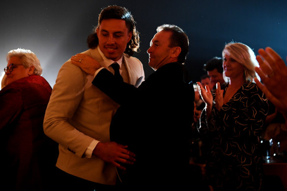 Joe Tapine and coach Ricky Stuart celebrate his Mal Meninga medal win as Canberra’s best player in 2022.