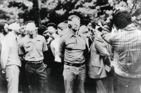The first day of occupation of the US embassy in Tehran in 1979 shows US hostages being paraded by their militant Iranian captors.