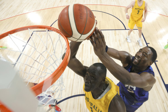 Duop Reath (left) battles USA’s Bam Adebayo in the Olympics warm-up match this week.