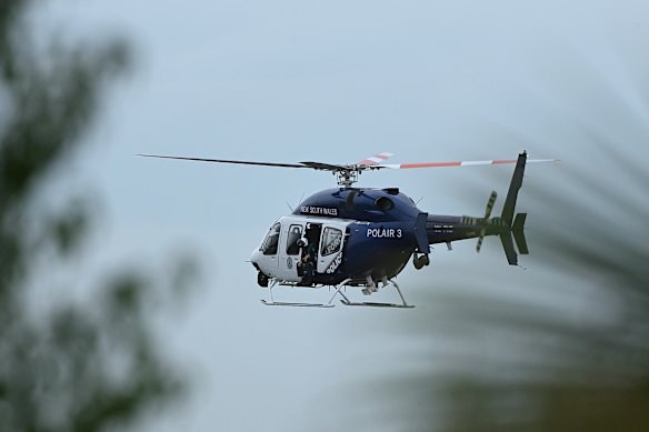 A NSW police helicopter scouring the search area.