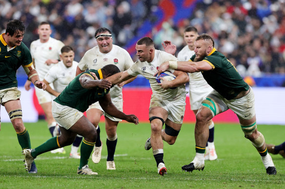 Ben Earl of England is tackled by Ox Nche and RG Snyman.