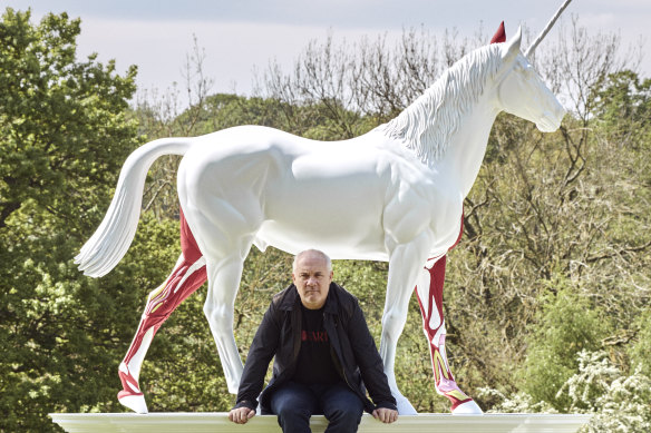 Hirst with one of his works, Myth, 2010.