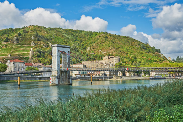 The historic suspension bridge across the River Rhone linking Tournon sur Rhone, Ardeche  and Tain l’Hermitage.