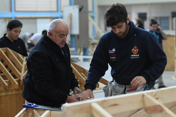 A master and apprentice carpenter at Holmesglen TAFE Chadstone campus in 2017. 