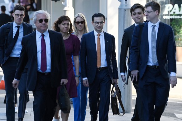 Surgeon Munjed Al Muderis (centre) and his legal team including Sue Chrysanthou, SC (left).