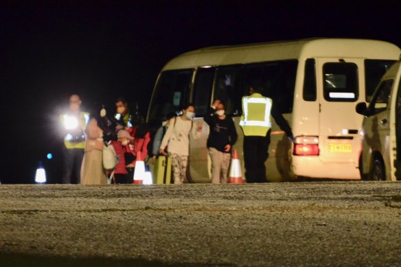 Australian passengers evacuated from Wuhan, China, arrive on Christmas Island Monday night.