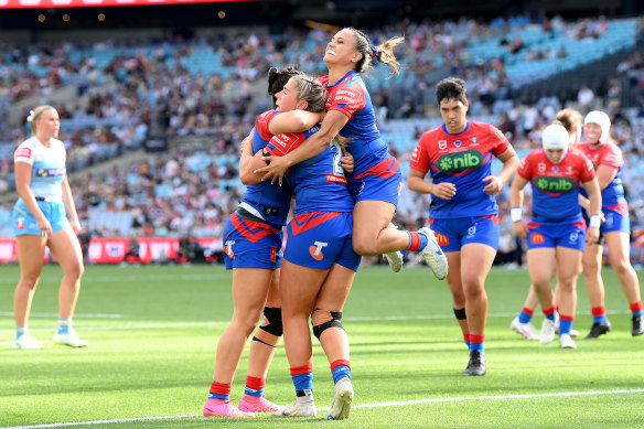 The Knights celebrate their grand final triumph in October.