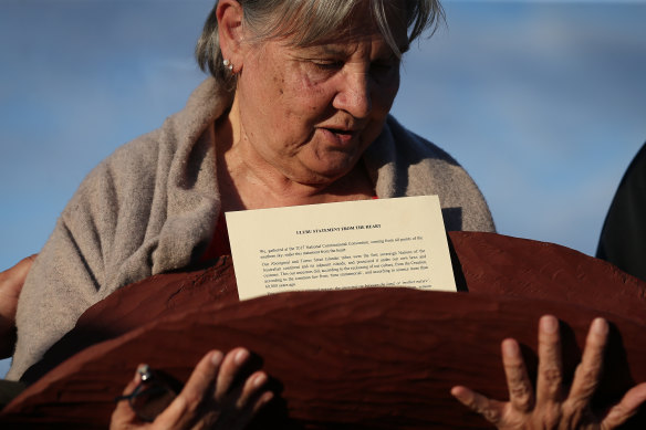 Pat Anderson from the Referendum Council with a piti holding the Uluru Statement from the Heart in May 2017.
