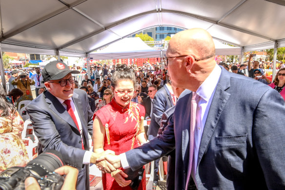 Prime Minister Anthony Albanese and Opposition Leader Peter Dutton shake hands at a Lunar New Year celebration in Box Hill in Melbourne’s east on Saturday.