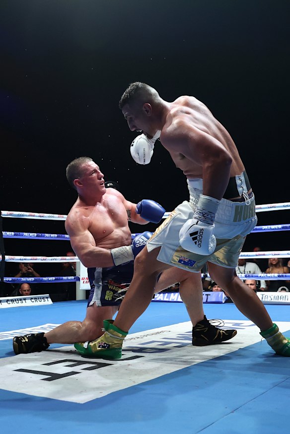 Justis Huni knocks Paul Gallen to the canvas.