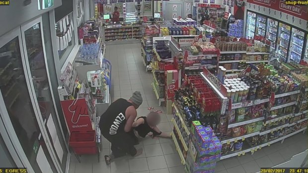 An image from CCTV footage of Josevski dragging his girlfriend out of the service station.