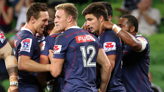 The Rebels celebrate a try from Tom English against the Reds.