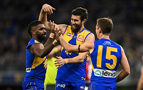 Liam Ryan, Josh Kennedy and Jamie Cripps celebrate a goal.