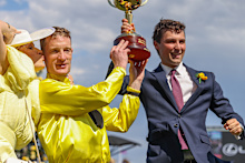 Top trainer Sam Freedman (right) celebrates the 2023 Melbourne Cup win alongside Without A Fight jockey Mark Zahra.